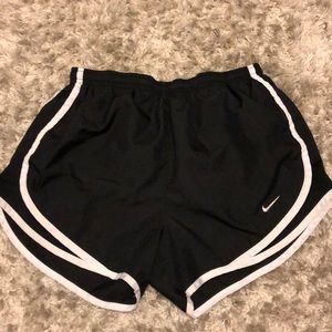 Black and white Nike running shorts